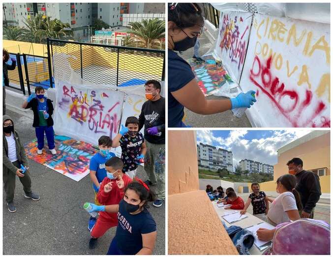 Escolares vistiendo con grafitis las paredes del CEIP Poeta Montiano Placeres/TA.